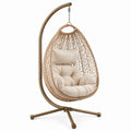Sillón colgante de ratán sintético y estructura de acero con cojín beige